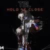 About TBL Hold me close Song