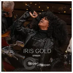 Iris Gold Synger Toppen Af Poppen