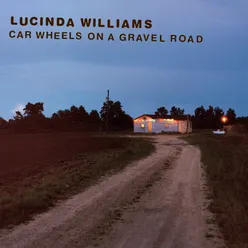 Car Wheels On A Gravel Road